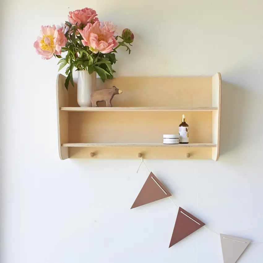 a shelf with flowers firma zoethout wandplankje